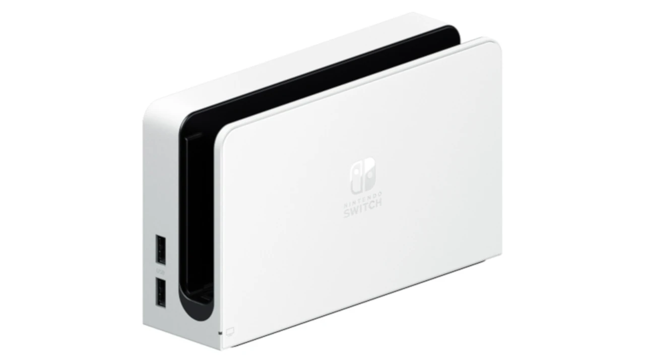 Close up on a plate of mashed potatoes, topped with baked pork chops with cream of mushroom soup, and a side of green beans.